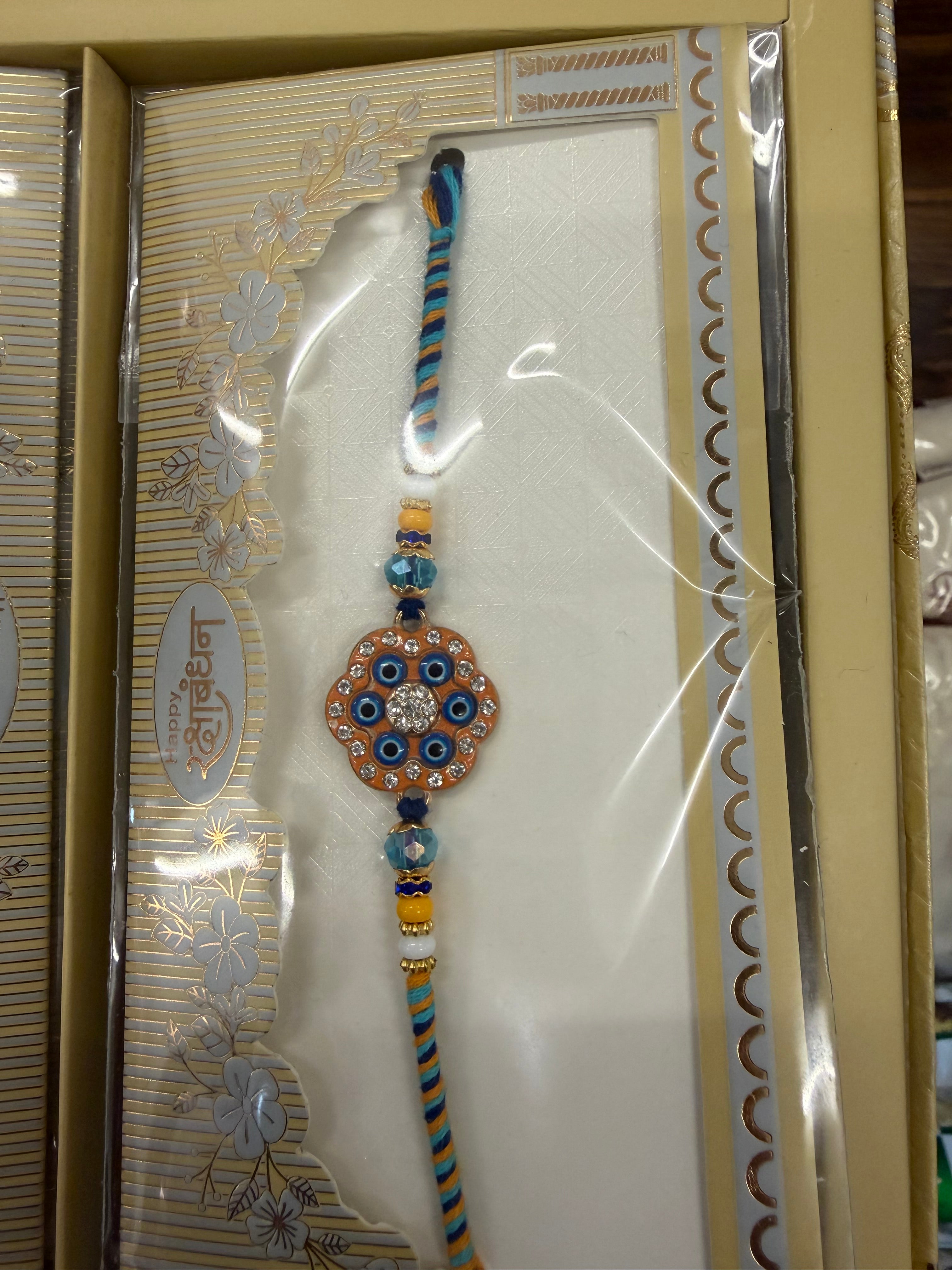 ROUND GOLDEN AND BLUE DESIGNER RAKHI